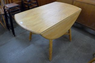 An Ercol Blonde elm and beech drop-leaf table
