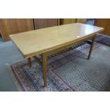 A Danish teak metamorphic dining/coffee table