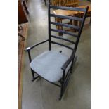 A Scandinavian ebonised rocking chair