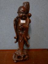An oriental carved hardwood figural Buddha lamp base