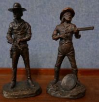 A pair of similar bronze figures of cowboys