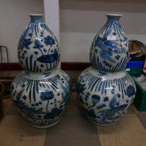 A pair of large Chinese blue and white porcelain double gourd shaped vases