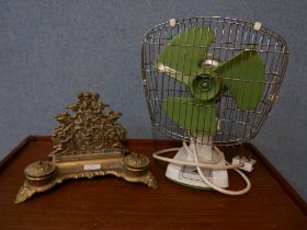 A vintage Xpelair Taurus desk fan and a brass desk stand