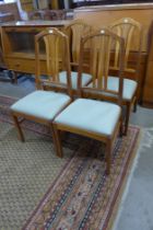 A set of four Parker Knoll teak dining chairs