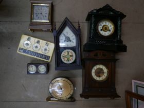 Five mantel clocks, a vintage Metricock weight converter, another timepiece and a cast metal wine