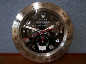 A Rolex style dealer's display wall clock