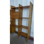 A Staples teak Ladderax two bay room divider, with stool