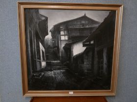 An indistinctly signed continental street scene, oil on canvas, framed