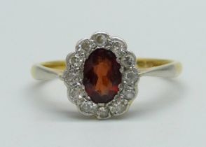 An 18ct gold, diamond and red stone ring, 2.4g, N