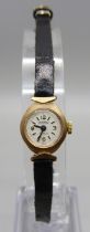 A lady's 9ct gold cased Roamer wristwatch and a 9ct gold bracelet strap, strap a/f and 6.7g