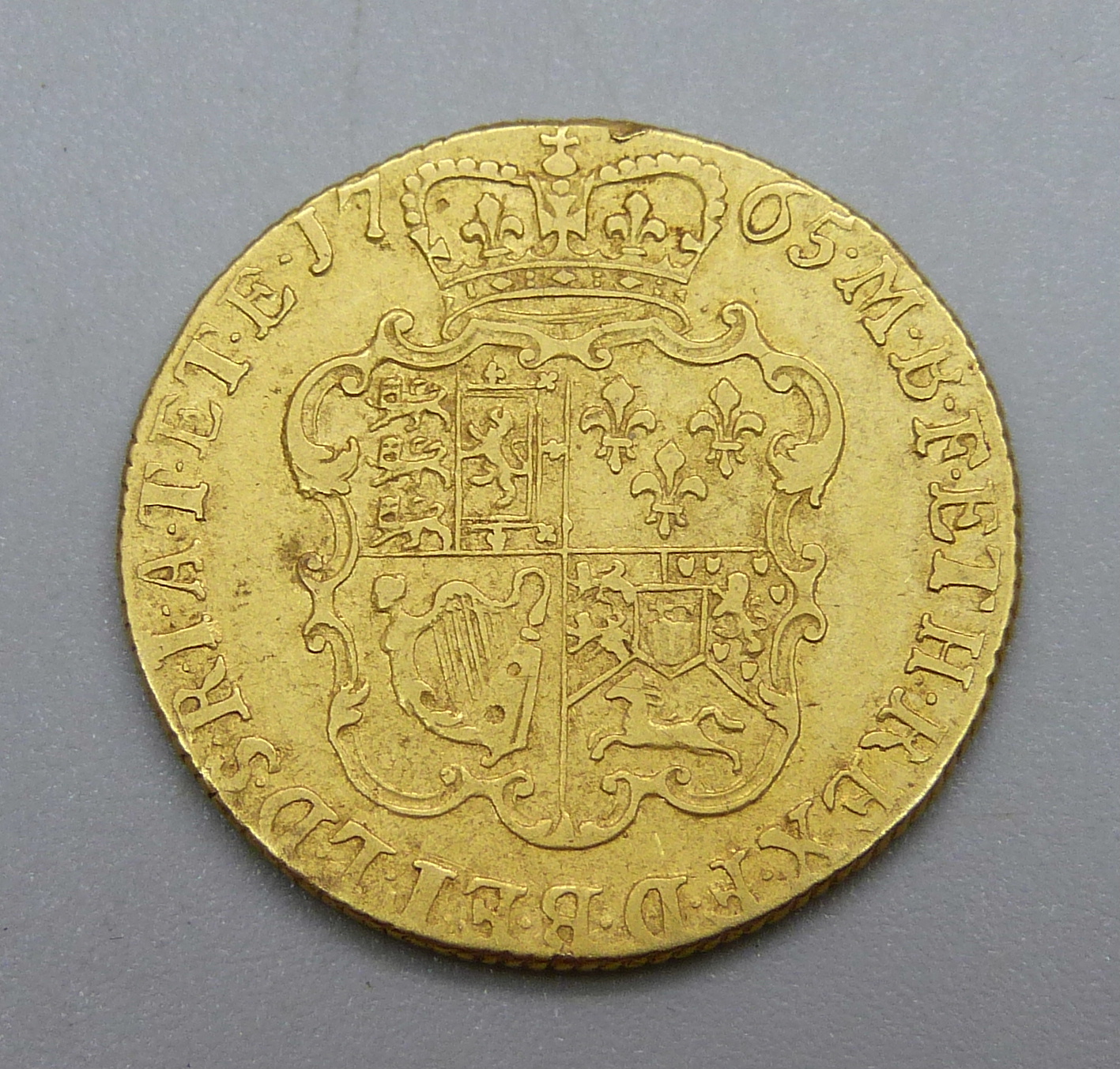 A George III 1765 gold guinea - Image 2 of 2