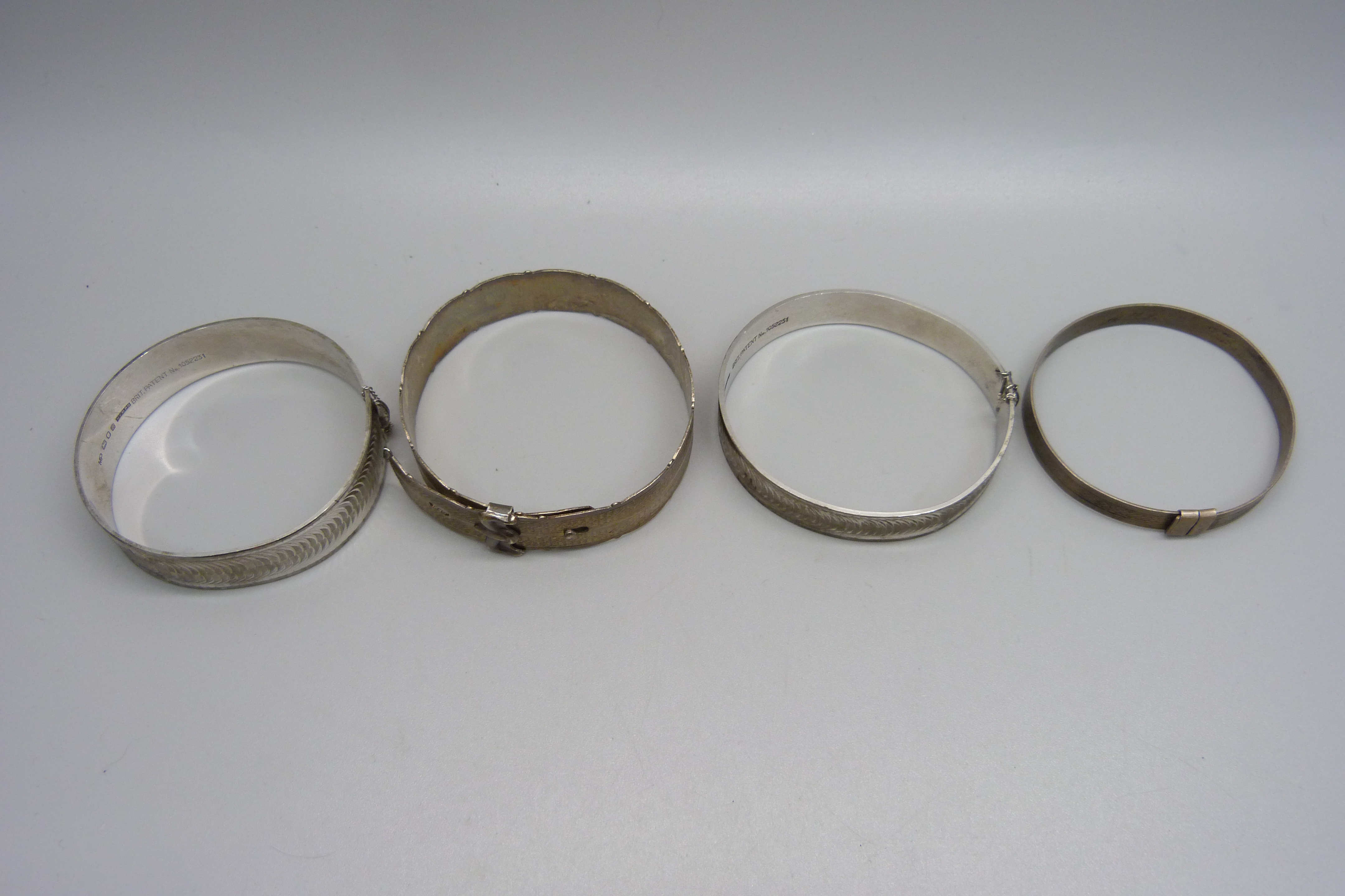 Four silver bangles including one buckle style with Edinburgh hallmark, 79g - Image 2 of 3
