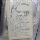 Football memorabilia; 24 1950s football programmes in folder