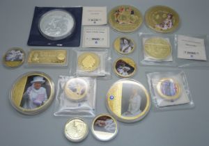 A collection of gold plated and other commemorative coins/medallions