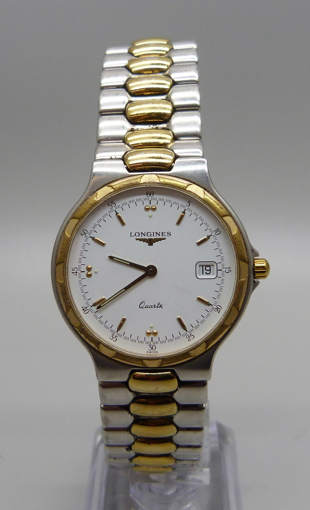 A Longines quartz wristwatch, requires clasp