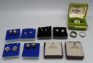 Five silver rings and six pairs of silver earrings