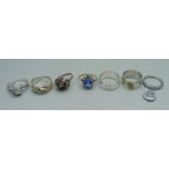 Five silver rings and two white metal rings, 30g, cluster ring lacking a stone