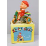 A small Chinese tin plate toy tricycle, boxed