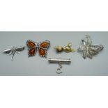 A silver, amber set butterfly brooch and four other silver brooches