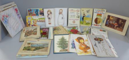 A collection of Mabel Lucie Attwell and other postcards and a bundle of early greeting cards