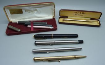 A collection of pens and pencils including a gold plated Fyne-Poynt pencil and Waterman's 503