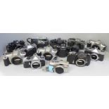 Thirteen vintage 35mm cameras and camera bodies including Olympus, Fujica, Canon and Nikkormat