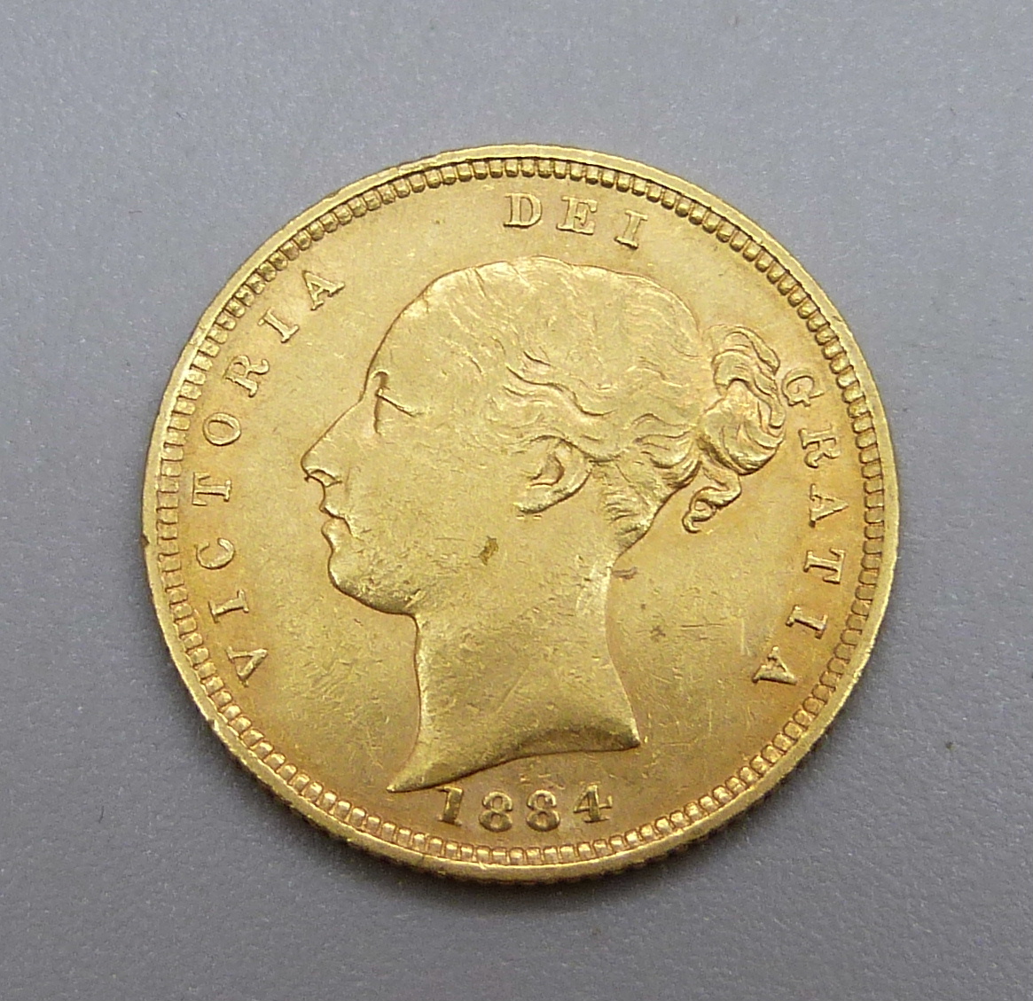 A Victorian 1884 gold half-sovereign