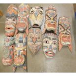 A collection of carved tribal masks **PLEASE NOTE THIS LOT IS NOT ELIGIBLE FOR POSTING AND PACKING**