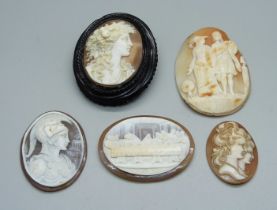 A cameo brooch and four unmounted carved cameos including The Last Supper