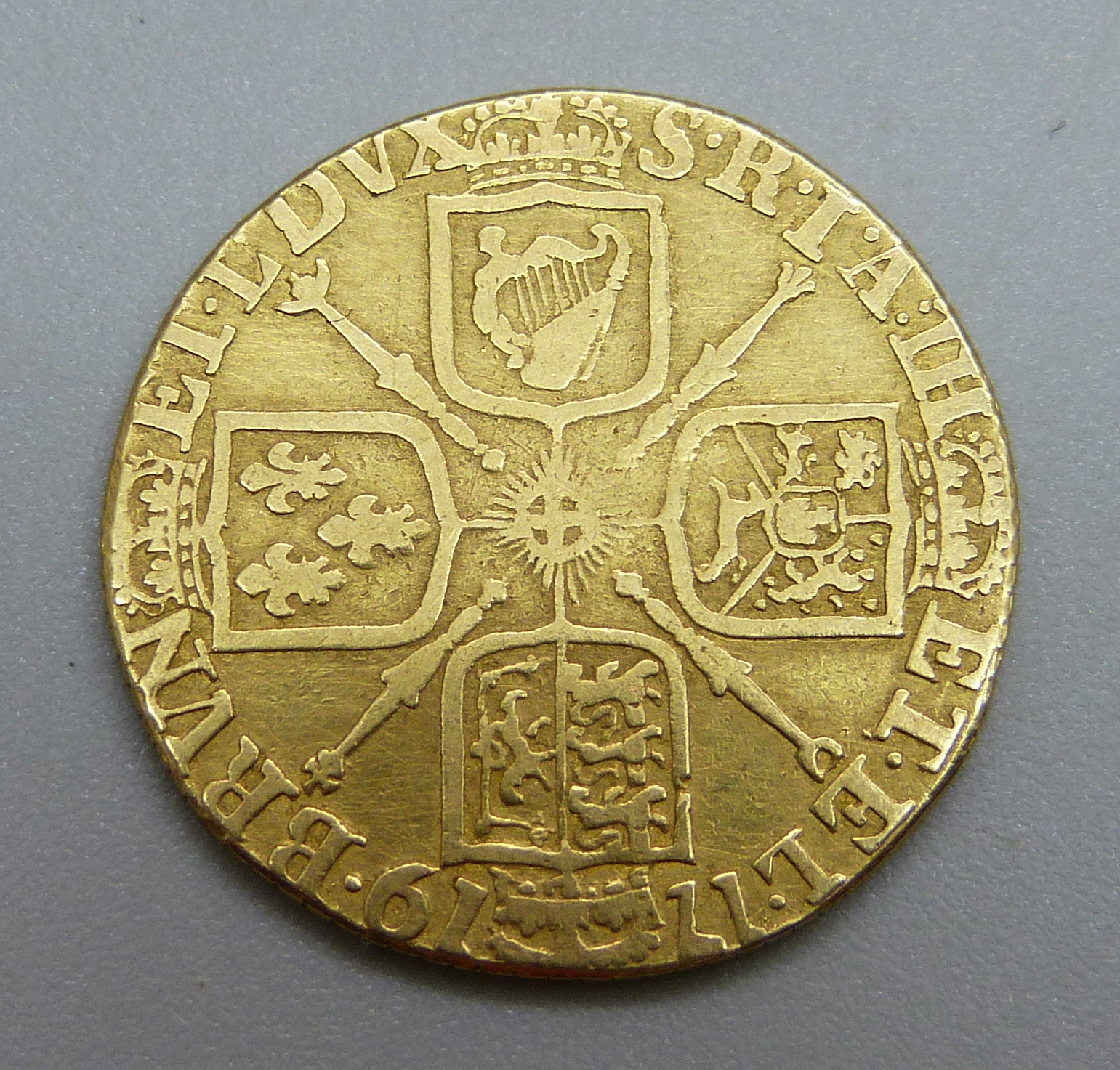 A George I 1719 gold guinea, worn, edge re-milled, 7.1g, - Image 2 of 2