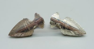 A pair of silver dress clips