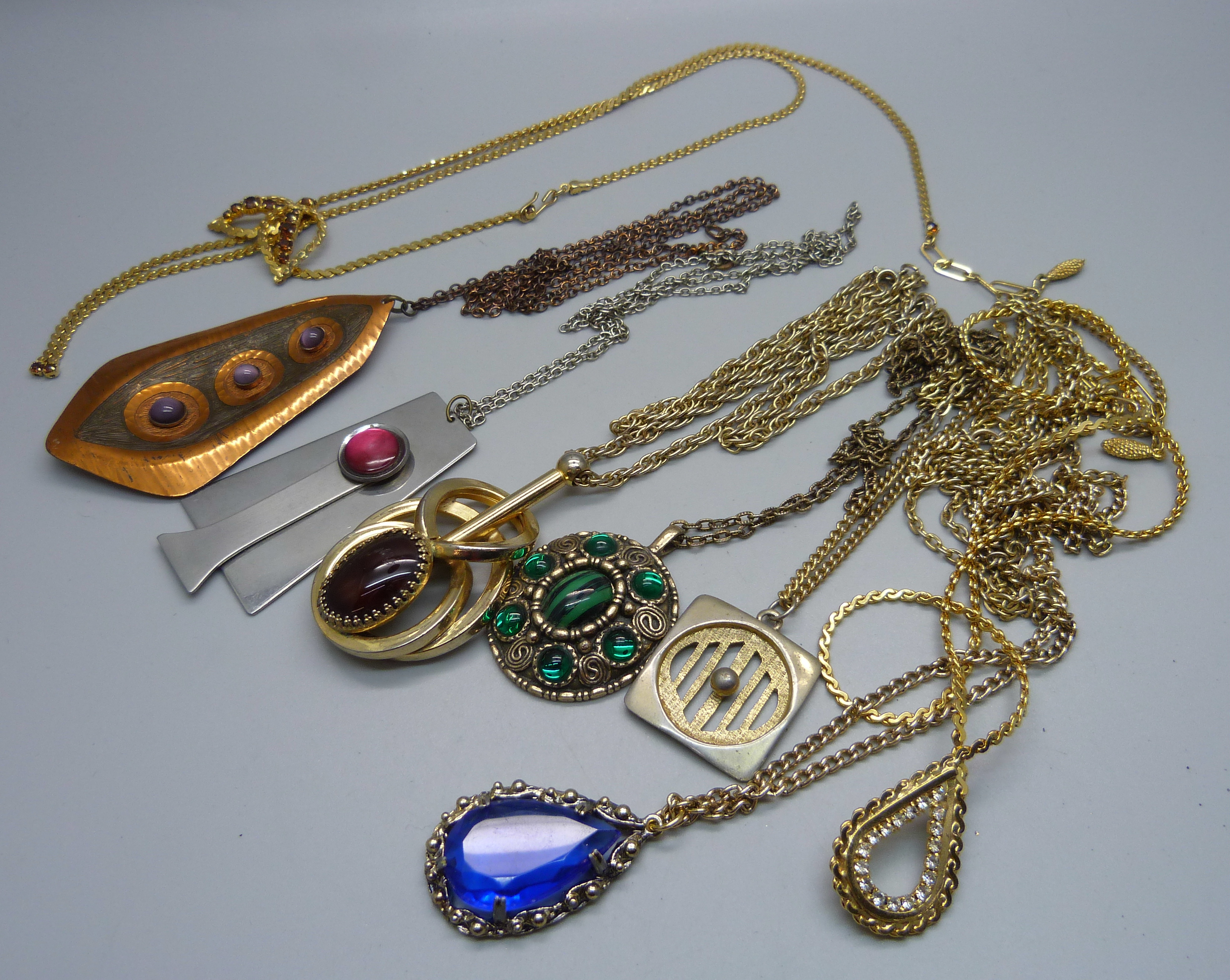 A collection of 1970s and 80s pendants including Moda, Miracle, etc.