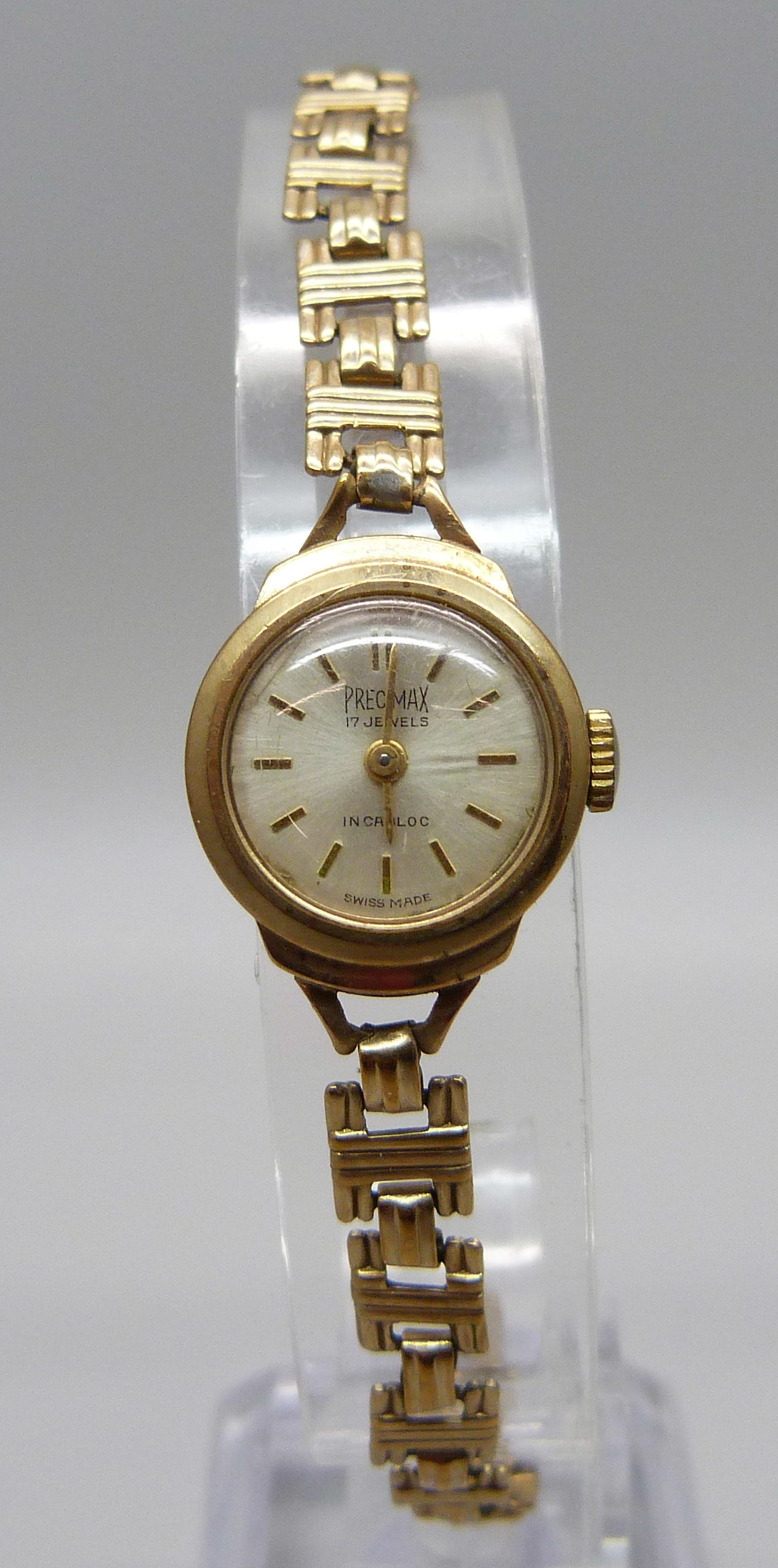 A lady's 9ct gold Precimax wristwatch on a 9ct gold strap, total weight with movement 12g, boxed