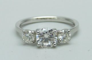 A platinum and three stone diamond ring, marked Plat, total diamond weight 1.14ct, (centre diamond