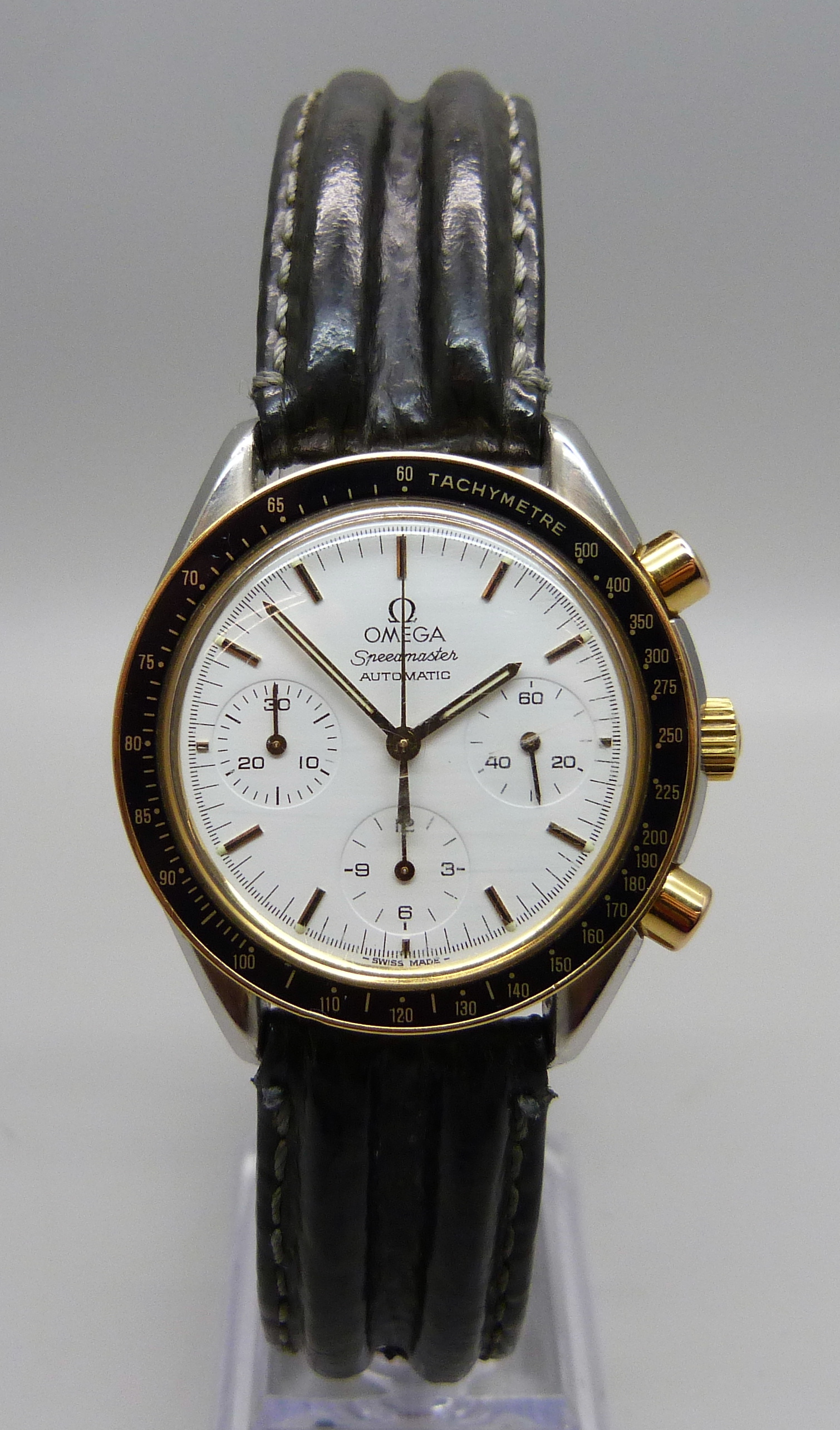 An Omega Speedmaster automatic wristwatch, boxed with papers, dated 1991