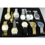 A case of wristwatches including Tara, Rotary, Mondaine, Newark and Titus
