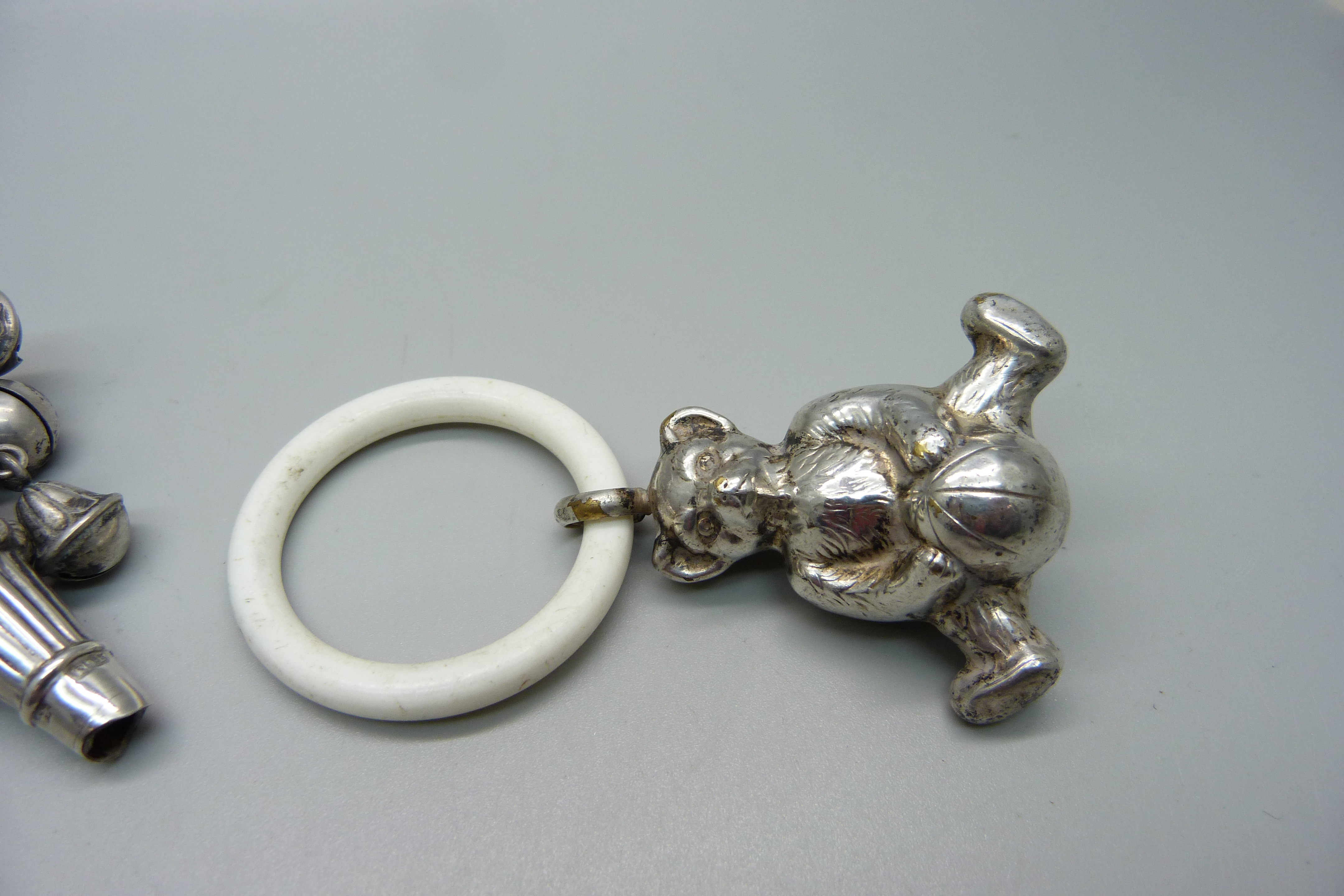 A Victorian silver rattle/whistle, Birmingham 1896, a Teddy bear rattle and a cat rattle - Image 4 of 4