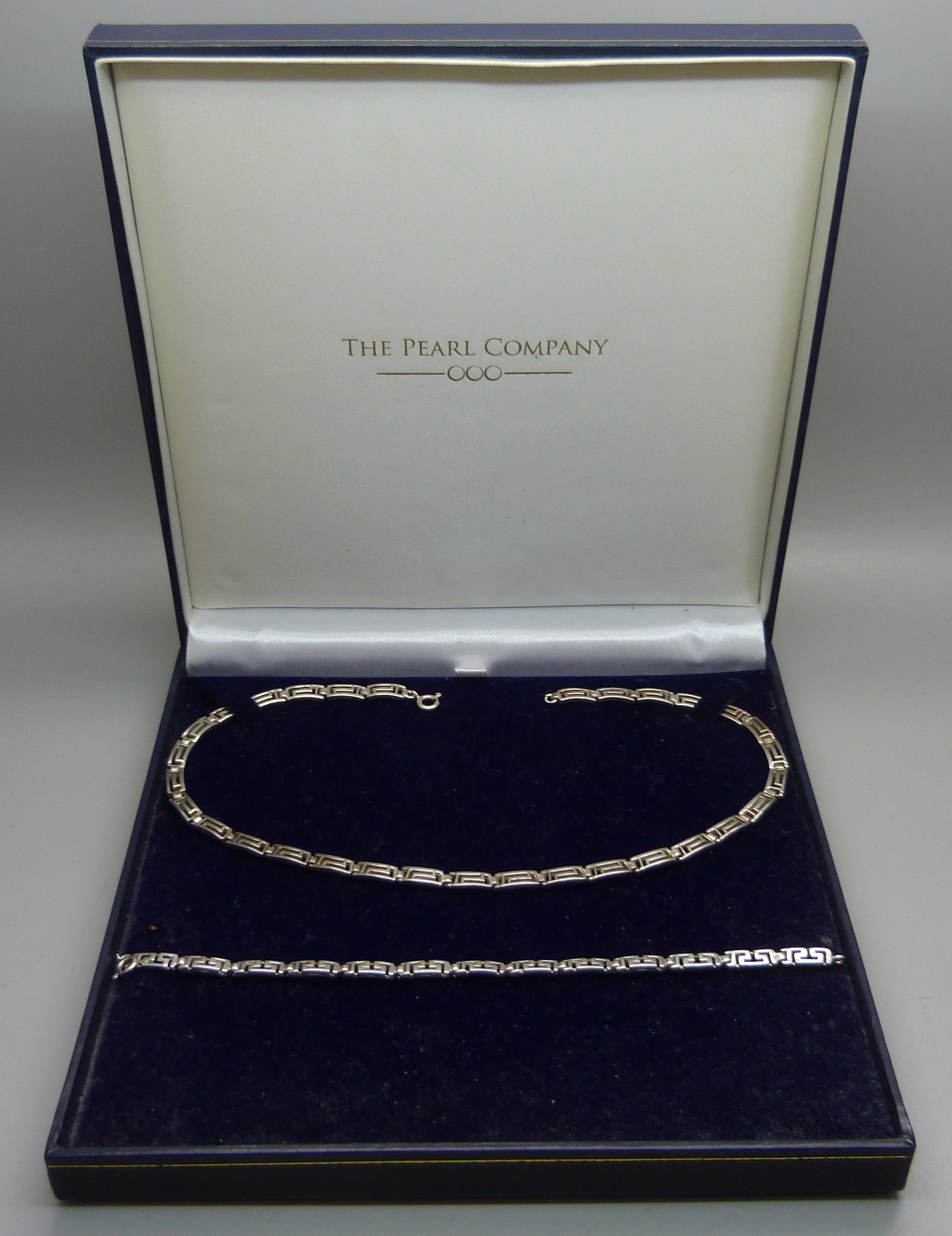 A silver necklace and bracelet