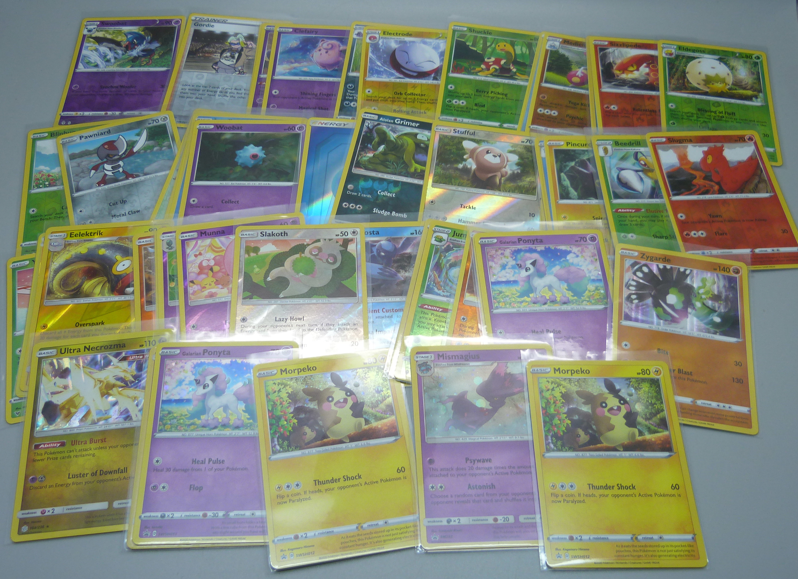 Fifty Holo/Reverse Holo Pokeman cards