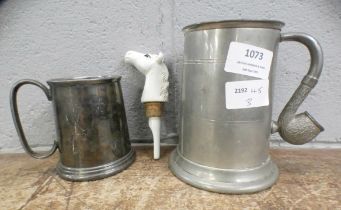 Two tankards, one with novelty pipe handle and a horse bottle pourer