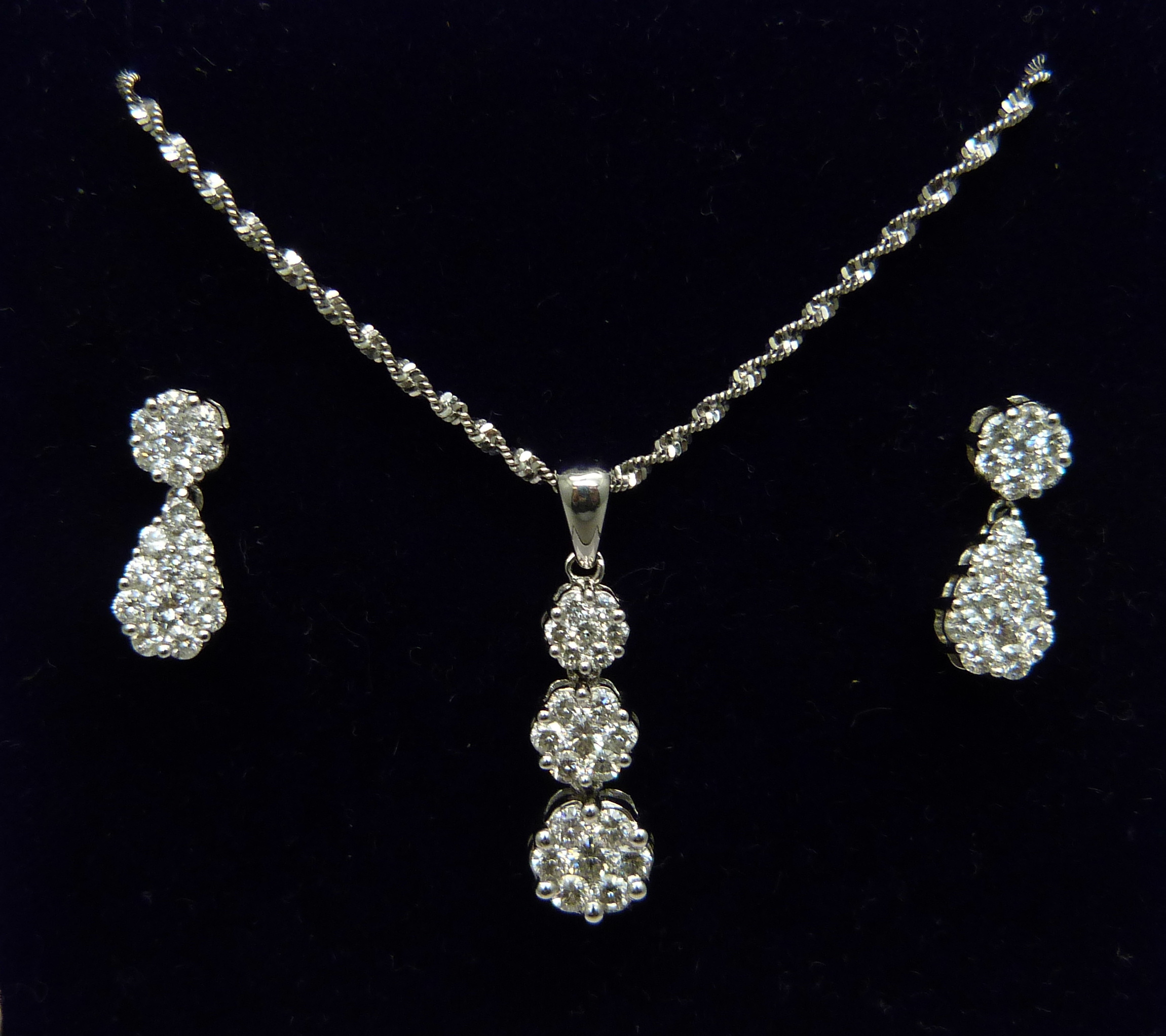 A 14ct white gold and diamond triple cluster drop pendant and chain and matching earrings (silver - Image 2 of 3