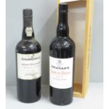 A bottle of Graham's Vintage Port 2010 wtih box and a bottle of Churchill's Crusted Port 2000