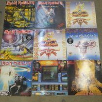 A collection of eight Iron Maiden LP records and nine 12" singles including a poster bag