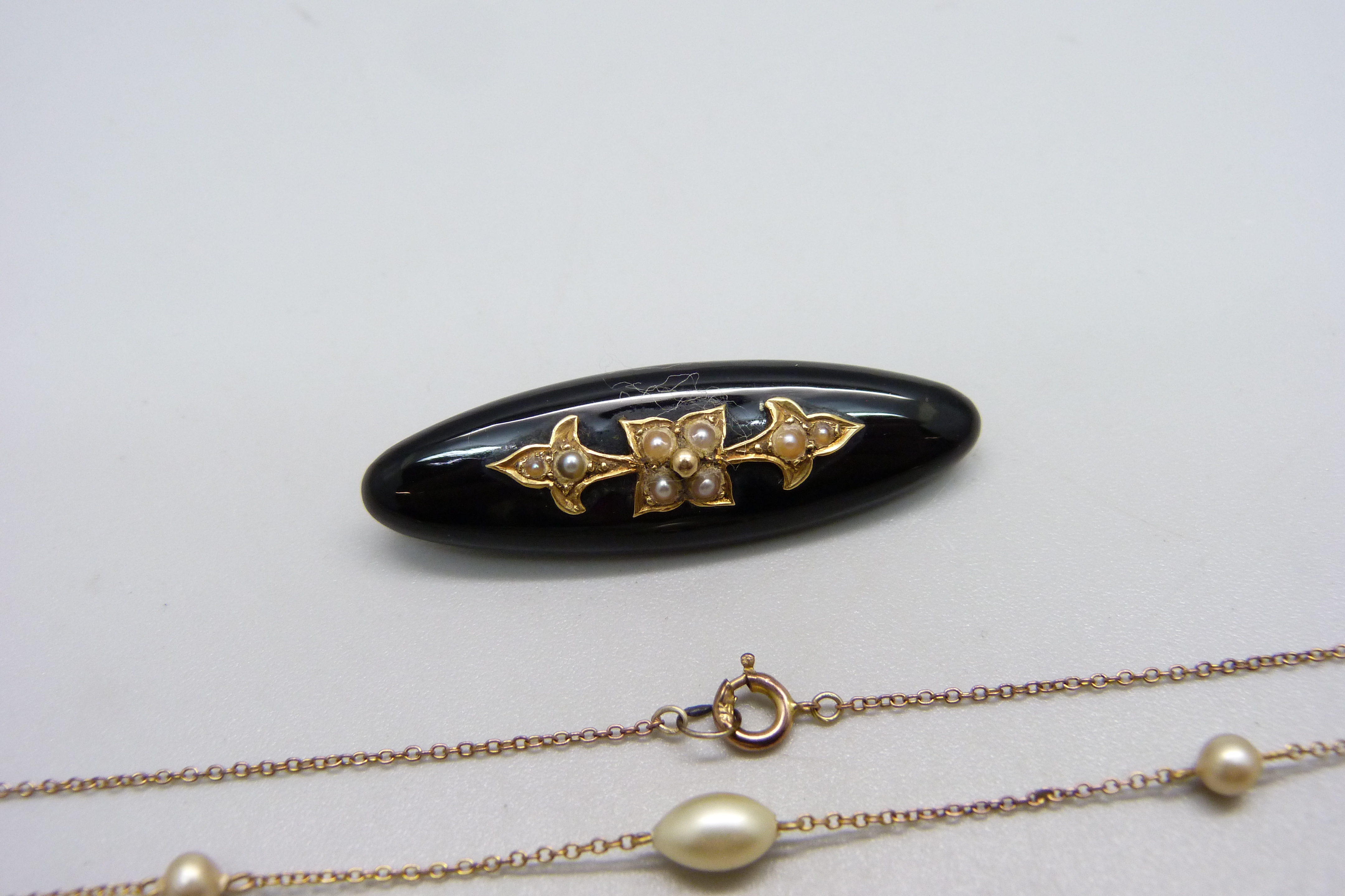 A Victorian mourning brooch set with seed pearls and a fine 9ct gold and pearl necklace, (very small - Image 2 of 4