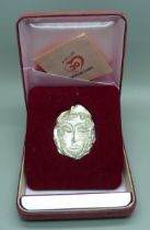 A Japanese '1000 Silver' cast of a face, Woman in the Hat, stamped Tasaki Shinju and signed Masuo '