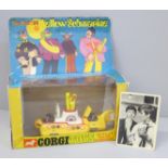 A Corgi Toys The Beatles Yellow Submarine, boxed and a facsimile signed picture card of George
