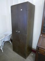 A vintage brown steel two door locker