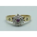 A 9ct gold, ruby and diamond cluster ring, 2.1g, N