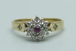 A 9ct gold, ruby and diamond cluster ring, 2.1g, N