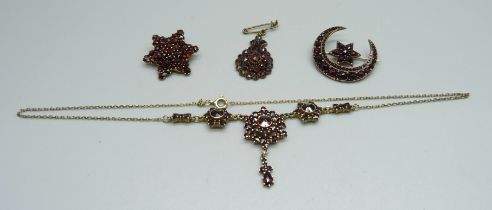 Bohemian garnet set jewellery, c1900, three brooches and a necklet